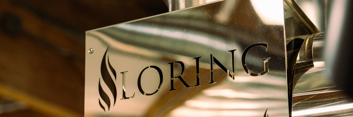 Loring logo etched into machine panel, with headroom above for text