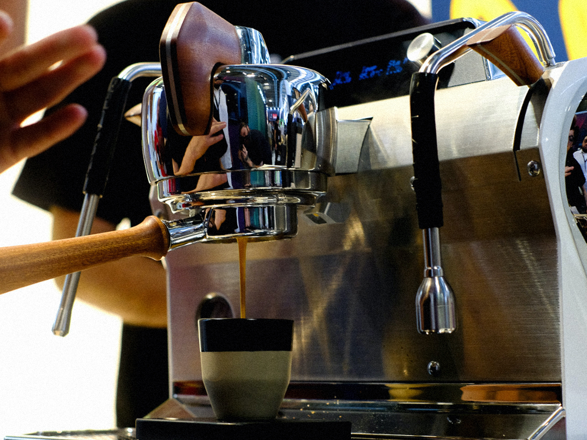 Espresso pouring from a Slayer machine into a cup